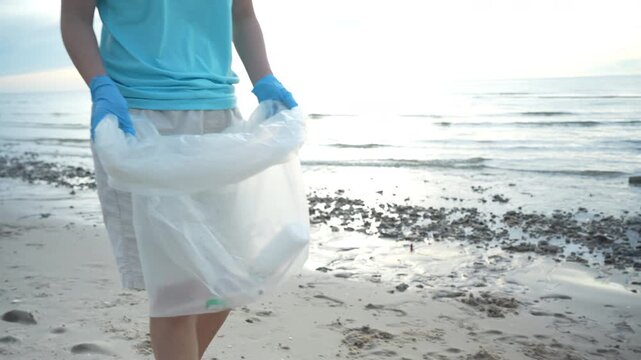 Save water. Volunteer pick up trash garbage at the beach and plastic bottles are difficult decompose prevent harm aquatic life. Earth, Environment, Greening planet, reduce global warming, Save world