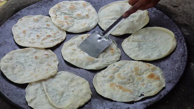 Indian paratha sizzling fresh on hotplate