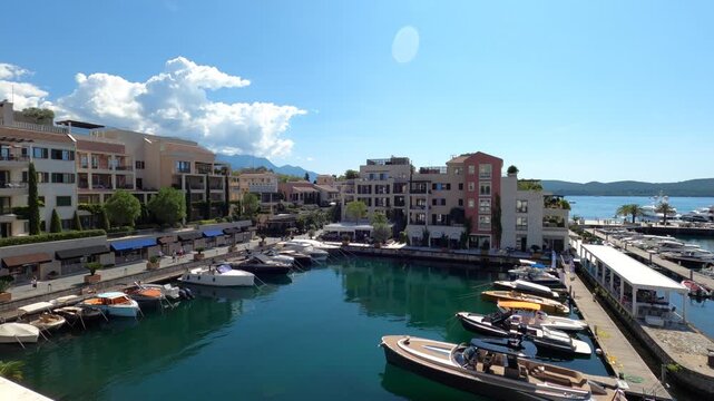 Tivat, Montenegro - June 29, 2025: Colorful Quay Houses At Porto Montenegro Canal