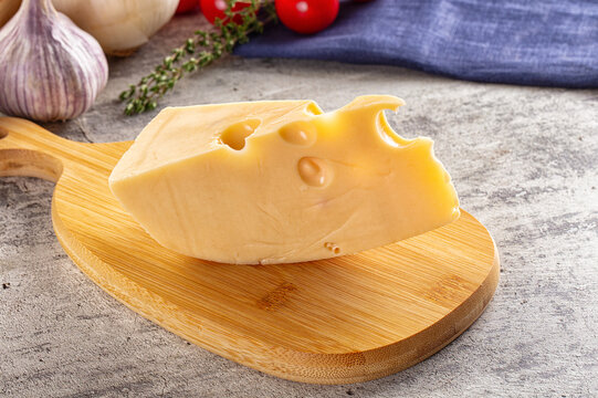 Yellow maasdam cheese triangle piece