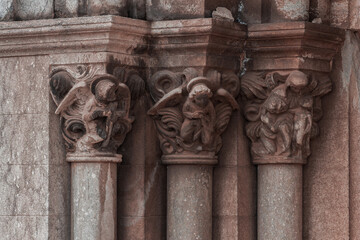 elements of architectural decorations of buildings, ancient arches and columns, pommel and patterns, on the streets in Catalonia, public places. © Kozlik_mozlik