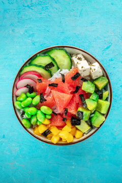 Vegan poke bowl with grapefruit, avocado, mango, edamame, radish