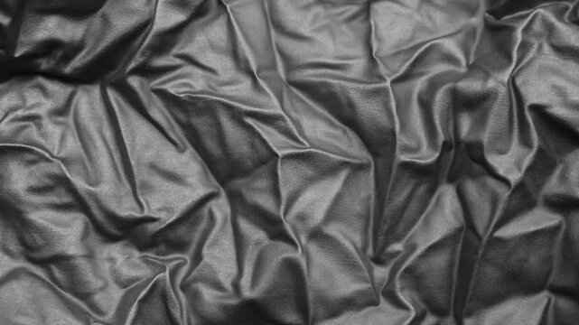 Abstract Black Rubber Latex Texture Background with Elegant Folds and Shadows