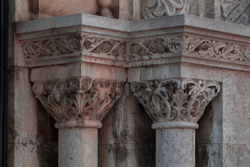 elements of architectural decorations of buildings, columns, pommel and patterns, on the streets in Barcelona, public places. © Kozlik_mozlik