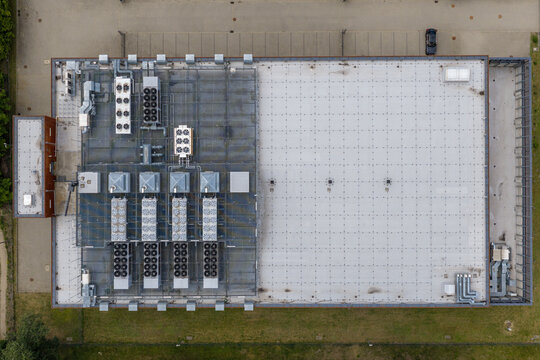 Aerial view of the roof of modern server farm building in industrial zone in Warszawa, Wojewodztwo mazowieckie, Poland.