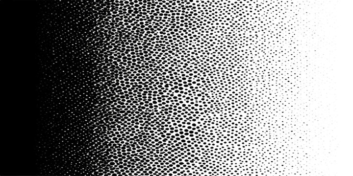A macro abstract background featuring a dark metallic surface with a textured black and white pattern of wet water drops