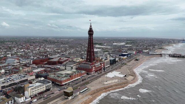 Blackpool Tower and beach high angle drone aerial push in shot