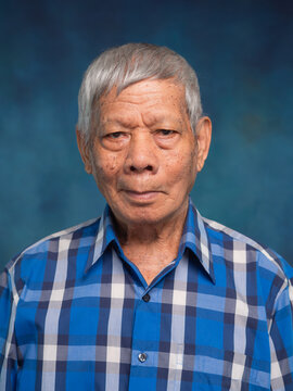 Senior Man Portrait Wearing Plaid Shirt