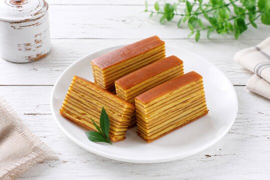 Traditional Indonesian Lapis Legit Cake &ndash; Classic Jajanan Pasar Layered Cake on White Plate