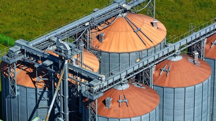 Detailed Aerial View of Large Grain Silos and Conveyor Systems © Maik