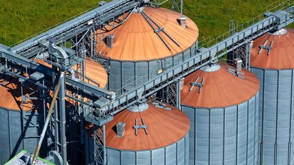 Detailed Aerial View of Large Grain Silos and Conveyor Systems © Maik