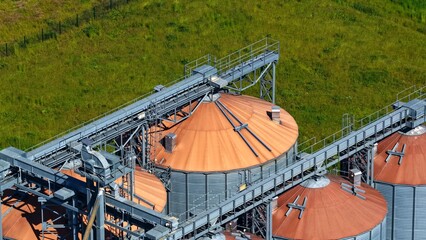 Detailed Aerial View of Large Grain Silos and Conveyor Systems © Maik