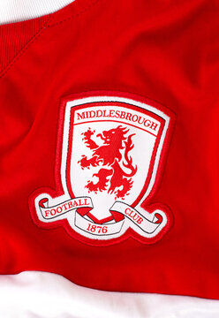 Kyiv, Ukraine. June 1, 2026. Close-up of the Middlesbrough Football Club embroidered crest on a red sports jersey fabric texture.