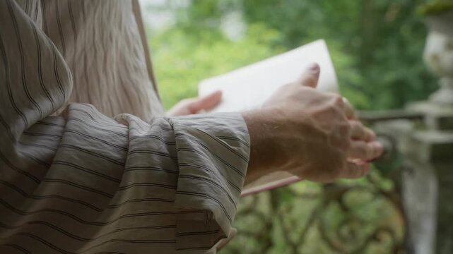 Close Up of Hands Flipping Through Book reading Book for wellness.