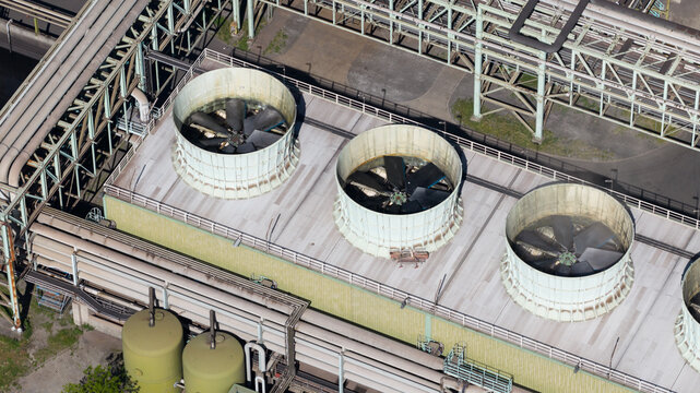 Aerial view of Kokerei Schwelgern KBS thyssenkrupp Steel showing industrial cooling fans, ventilation systems, and metal pipes in Duisburg, North Rhine-Westphalia, Germany.
