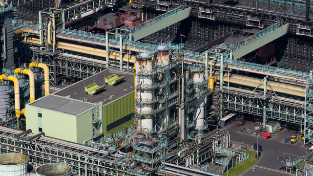Aerial view of Kokerei Schwelgern KBS thyssenkrupp Steel with industrial pipes and complex steel structures in Duisburg, North Rhine-Westphalia, Germany.