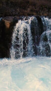 Epic Waterfall in scenic iceland nature, aerial shot - vertical video
