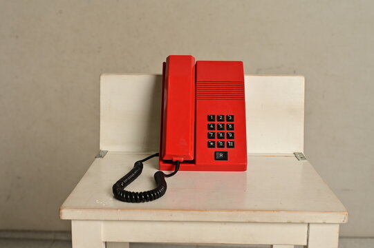 Old red buttom telephone, antique
