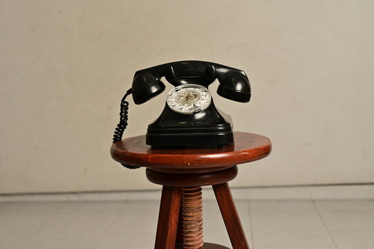 an old telephone with rotary dial