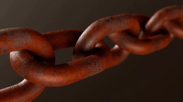 Rusty metal chain close up against a dark blurred background