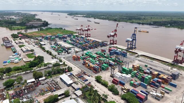 Aerial view of containers stacked in the port area and ready to be loaded onto ships