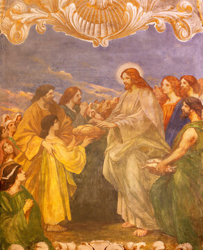 VERCELLI, ITALY - JANUARY 17, 2026: The fresco of miracle Feeding the multitude in the church Chiesa di san Salvatore by G. Porta from 20. cent.