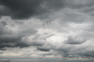 Obraz premium Dramatic storm clouds for the background. Isolated summer storm clouds before a thunderstorm. Dark storm clouds before the rain. Bad weather. A heavenly landscape of clouds in the sky on a rainy day.