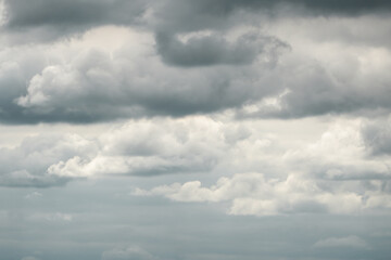 Obraz premium Dramatic storm clouds for the background. Isolated summer storm clouds before a thunderstorm. Dark storm clouds before the rain. Bad weather. A heavenly landscape of clouds in the sky on a rainy day.