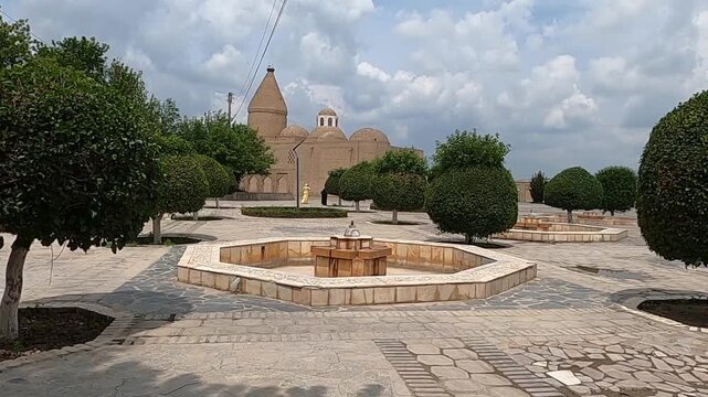 Chashma Ayub Mausoleum with conical dome and fountain square in Bukhara