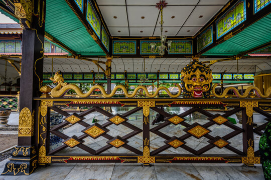 Ornate golden dragon sculpture at Taman Sari in Yogyakarta