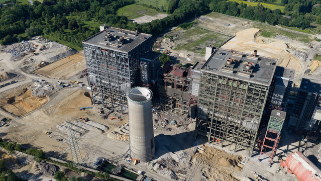 Aerial view of the Kraftwerk Voerde power plant featuring industrial steel structures and a concrete chimney base during demolition in Voerde, North Rhine-Westphalia, Germany.