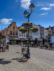 Naklejka premium Grote Markt with tables of restaurants in Mechelen, Belgium. Mechelen is a city and municipality in the province of Antwerp, Flanders, Belgium.