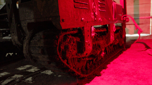 A high-quality image of an unmanned ground combat vehicle in a secure facility. Representing the next generation of war, this UGV highlights the shift toward robotic and autonomous systems in global d