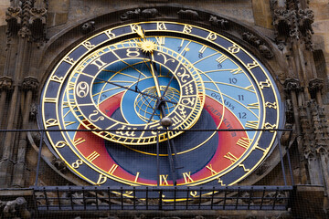 Obraz premium Detailed macro shot of the astronomical dial of the Prague Orloj, showcasing intricate gold zodiac symbols and medieval mechanism.