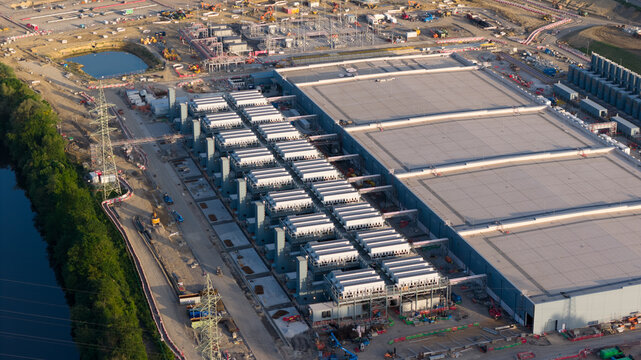 Aerial view of the Charleroi SAM 3A energy storage facility with rows of cooling units and industrial buildings Farciennes, Region wallonne, Belgium.