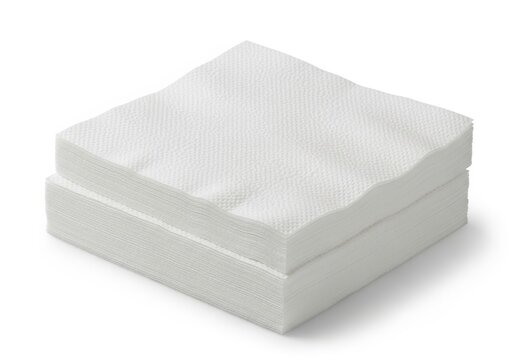 Stacked white foam or memory foam mattress topper pieces isolated on white background