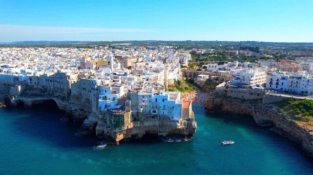 Polignano a Mare - Italy, Apulia - clockwise aerial view along the houses on the cliffs