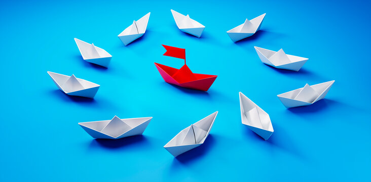 Group of  white paper boats with red leader in the middle on blue background - 3D illustration
