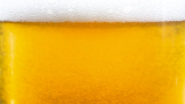 Beer in a glass. The drink is poured into the glass.