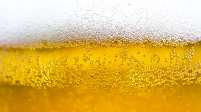Beer in a glass. The drink is poured into the glass.