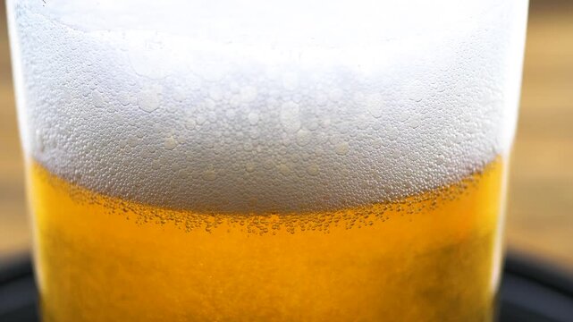 Beer in a glass. The drink is poured into the glass.