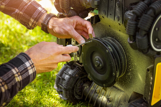 Blades change. Robotic lawn mower maintenance and repair at home
