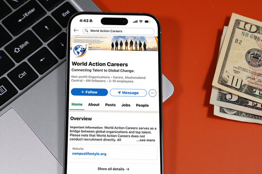 Kiel, Germany - 05-20-2026: World Action Careers International career development and staffing services company Profile on LinkedIn displayed in a workspace enviroment with laptop