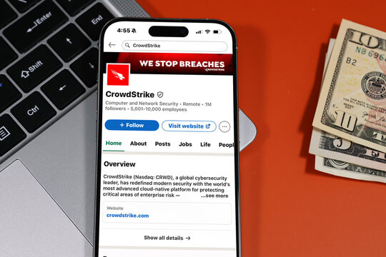 Kiel, Germany - 05-20-2026: CrowdStrike United States cybersecurity technology company Profile on LinkedIn displayed in a workspace enviroment with laptop