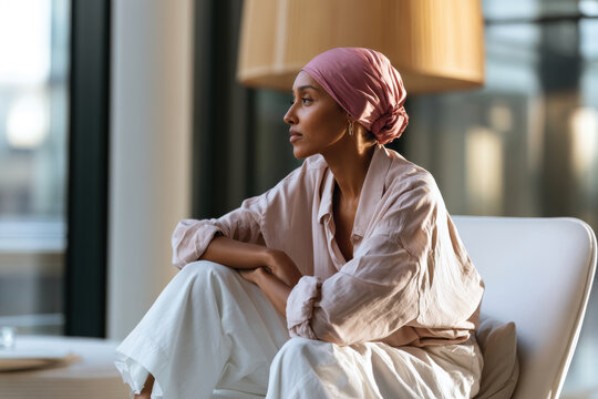 A serene portrait of a woman sitting thoughtfully, showcasing her profile as she gazes into the distance, embodying a moment of reflection and inner peace.