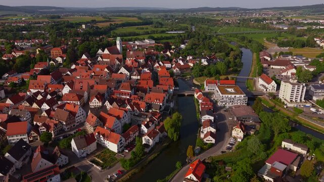 Aerial cityscape of Riedlingen, Germany, showing Old Town skyline, St. Georg Church, red roofs and Danube River in the Biberach district. Luftbild von Riedlingen, Deutschland