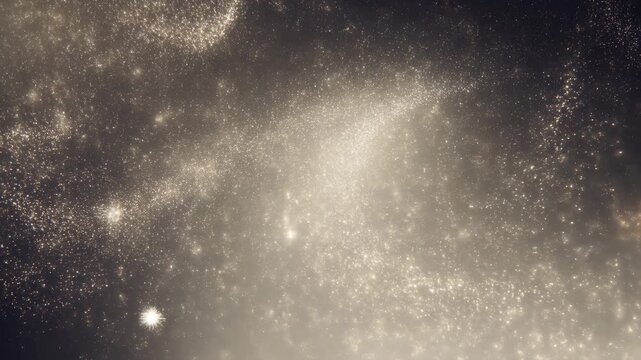 Macro shimmering gold and silver glitter particles with bokeh highlights on a dark softly backlit background