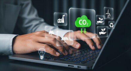 Naklejka premium Businessman working on laptop with eco-friendly technology icons, symbolizing sustainability and carbon reduction
