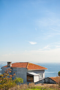 Seaside house overlooks blue horizon