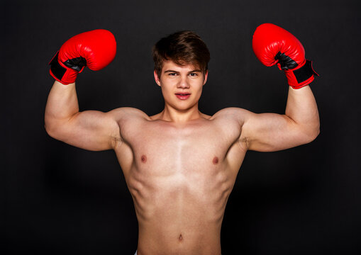 Muscular Boxer Flexing Arms.